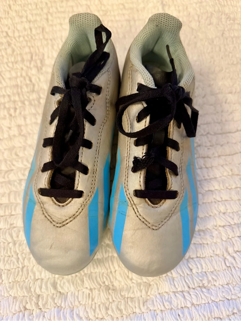 adidas Kids Messi Soccer Cleats in Light Gray with Blue Stripes